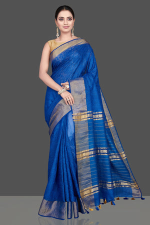 Shop gorgeous blue Kota tussar saree online in USA with golden zari border. Flaunt ethnic fashion on special occasions in stunning georgette sarees, designer saris, embroidered sarees, pure silk sarees, Kanchipuram sarees from Pure Elegance Indian fashion store in USA.-full view