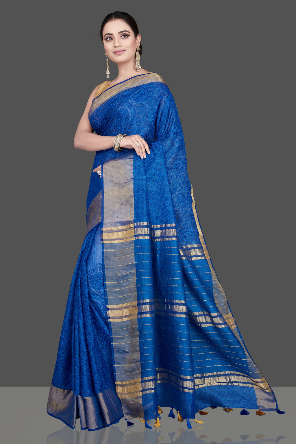 Shop gorgeous blue Kota tussar saree online in USA with golden zari border. Flaunt ethnic fashion on special occasions in stunning georgette sarees, designer saris, embroidered sarees, pure silk sarees, Kanchipuram sarees from Pure Elegance Indian fashion store in USA.-pallu