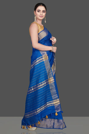 Shop gorgeous blue Kota tussar saree online in USA with golden zari border. Flaunt ethnic fashion on special occasions in stunning georgette sarees, designer saris, embroidered sarees, pure silk sarees, Kanchipuram sarees from Pure Elegance Indian fashion store in USA.-side
