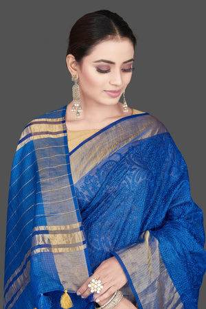Shop gorgeous blue Kota tussar saree online in USA with golden zari border. Flaunt ethnic fashion on special occasions in stunning georgette sarees, designer saris, embroidered sarees, pure silk sarees, Kanchipuram sarees from Pure Elegance Indian fashion store in USA.-closeup