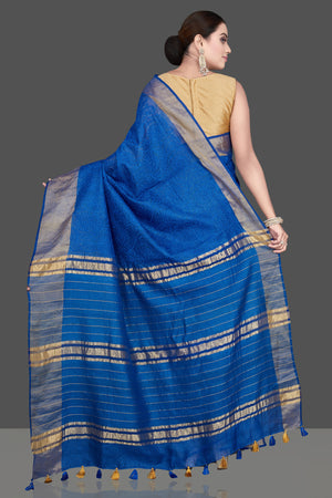 Shop gorgeous blue Kota tussar saree online in USA with golden zari border. Flaunt ethnic fashion on special occasions in stunning georgette sarees, designer saris, embroidered sarees, pure silk sarees, Kanchipuram sarees from Pure Elegance Indian fashion store in USA.-back