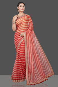 Shop beautiful cream and red striped and embroidered organza saree online in USA. Turn heads on special occasion in stunning handwoven sarees, organza saris, pure silk sarees, Banarasi sarees, embroidered sarees from Pure Elegance Indian saree store in USA.-full view