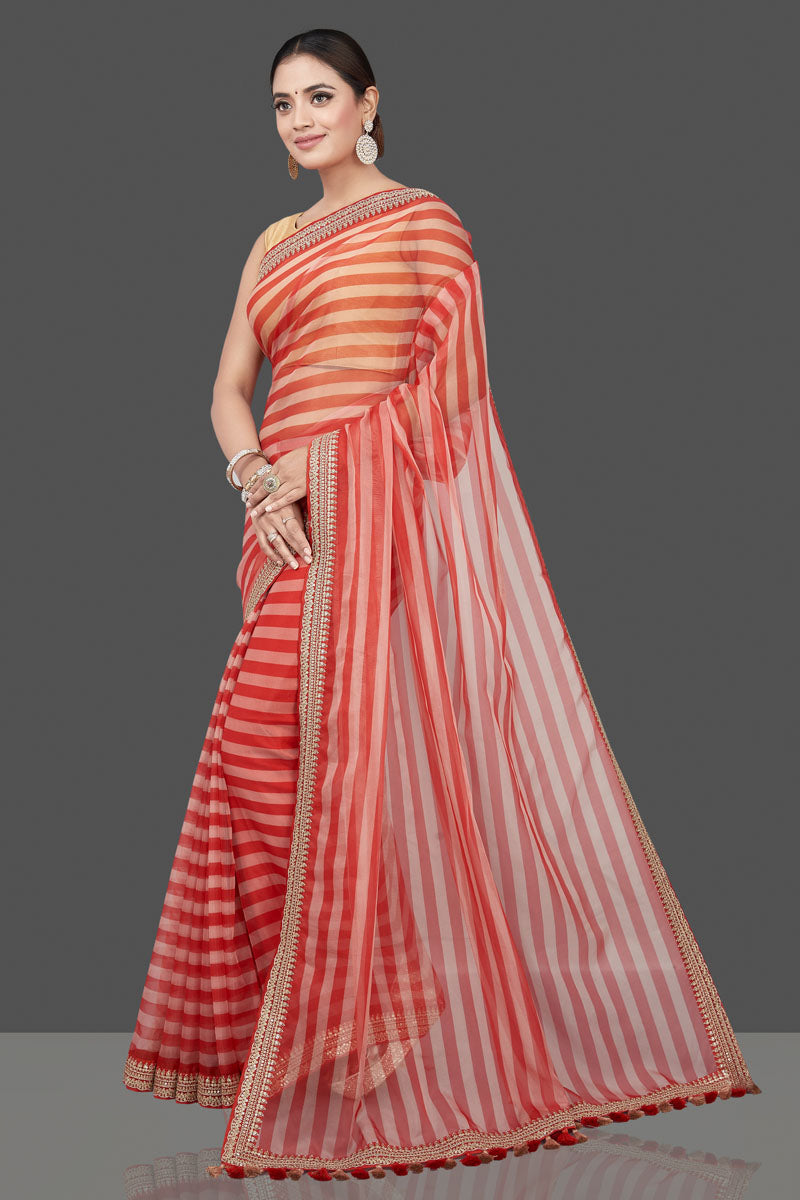 Shop beautiful cream and red striped and embroidered organza saree online in USA. Turn heads on special occasion in stunning handwoven sarees, organza saris, pure silk sarees, Banarasi sarees, embroidered sarees from Pure Elegance Indian saree store in USA.-pallu