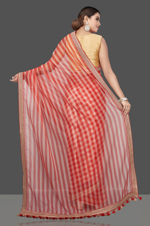 Shop beautiful cream and red striped and embroidered organza saree online in USA. Turn heads on special occasion in stunning handwoven sarees, organza saris, pure silk sarees, Banarasi sarees, embroidered sarees from Pure Elegance Indian saree store in USA.-back