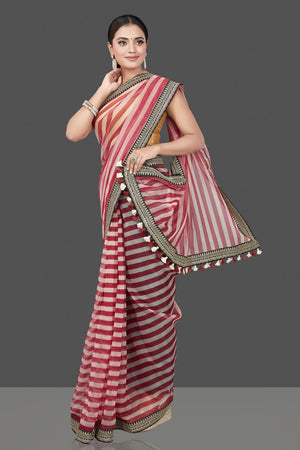 Buy beautiful red and cream striped organza saree online in USA with embroidered border. Turn heads on special occasion in stunning handwoven sarees, organza saris, pure silk sarees, Banarasi sarees, embroidered sarees from Pure Elegance Indian saree store in USA.-pallu