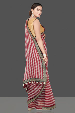 Buy beautiful red and cream striped organza saree online in USA with embroidered border. Turn heads on special occasion in stunning handwoven sarees, organza saris, pure silk sarees, Banarasi sarees, embroidered sarees from Pure Elegance Indian saree store in USA.-back