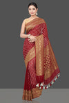Buy beautiful maroon georgette sari online in USA with zari buta and border. Get your hands on beautiful Indian handloom sarees, pure silk saris, designer sarees, embroidered sarees, Banarasi sarees from Pure Elegance Indian fashion store in USA.-full view