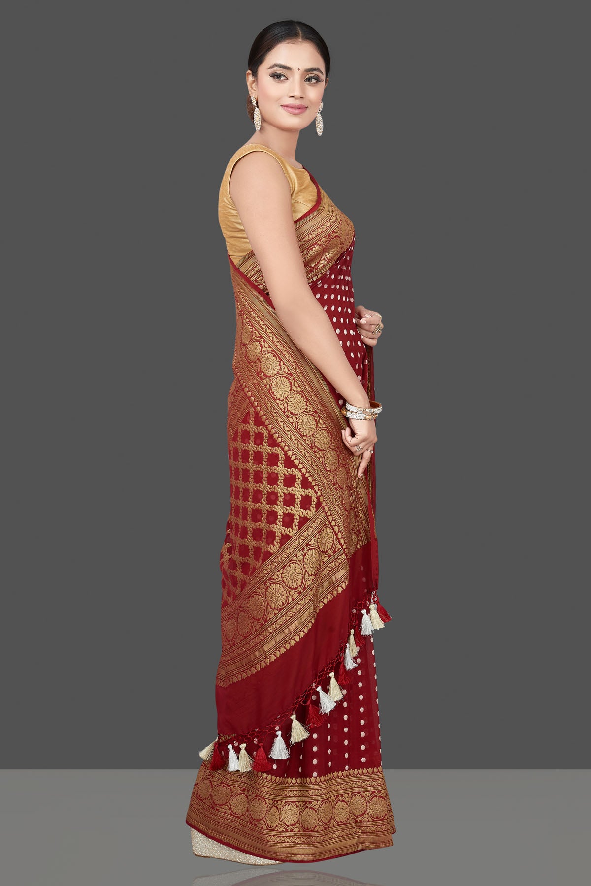 Buy beautiful maroon georgette sari online in USA with zari buta and border. Get your hands on beautiful Indian handloom sarees, pure silk saris, designer sarees, embroidered sarees, Banarasi sarees from Pure Elegance Indian fashion store in USA.-side