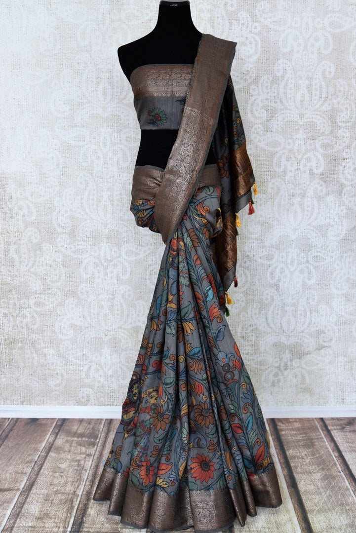 Shop gorgeous dark grey Kalamkari print tussar silk sari online in USA with zari border. Look attractive on special occasions in the beautiful silk sarees, designer saris, embroidered sarees, handwoven saris from Pure Elegance Indian fashion store in USA.-full view