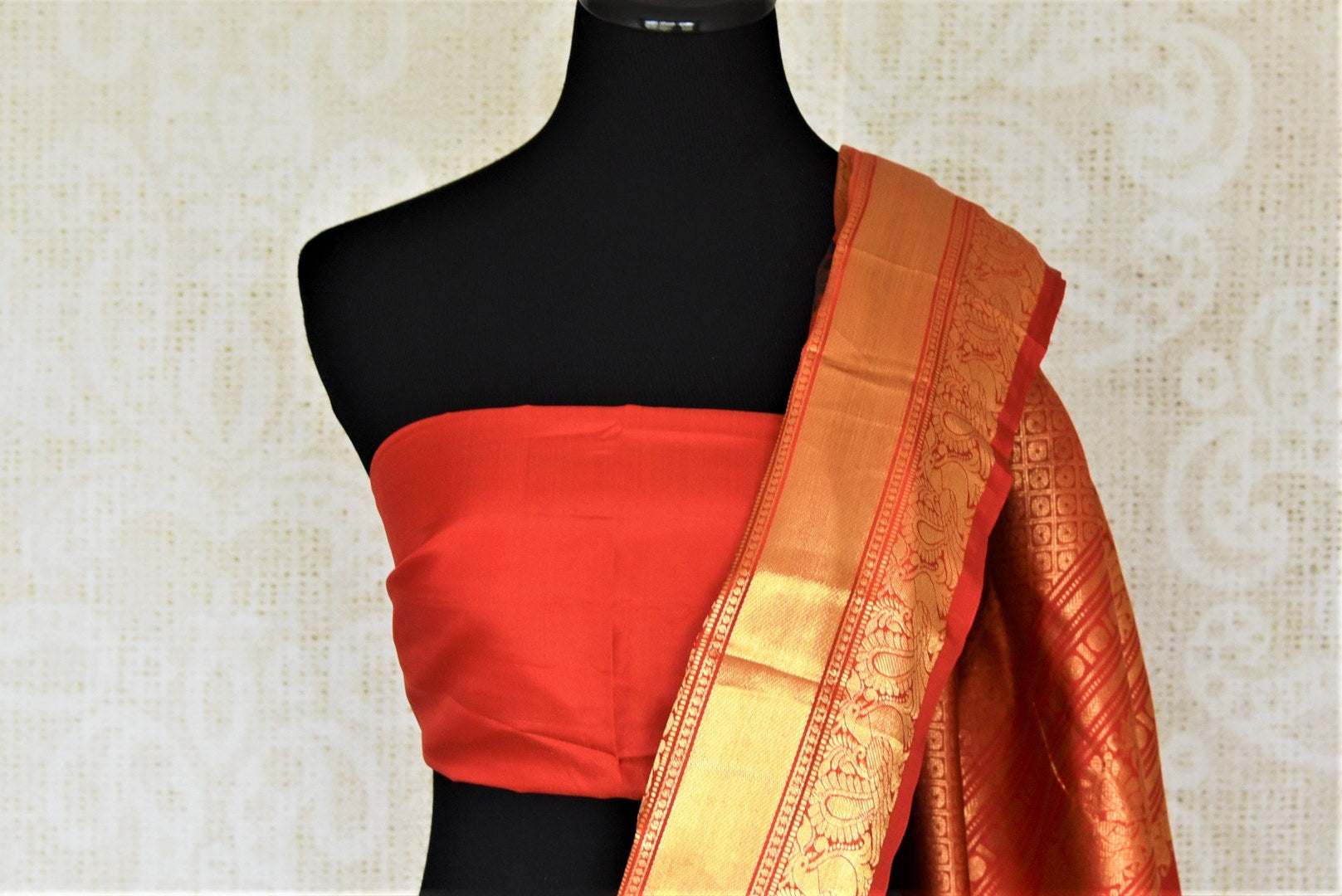 Buy beautiful red Gadhwal silk printed saree online in USA with golden zari border. Look attractive on special occasions in the beautiful silk sarees, designer saris, embroidered sarees, handwoven saris from Pure Elegance Indian fashion store in USA.-blouse pallu
