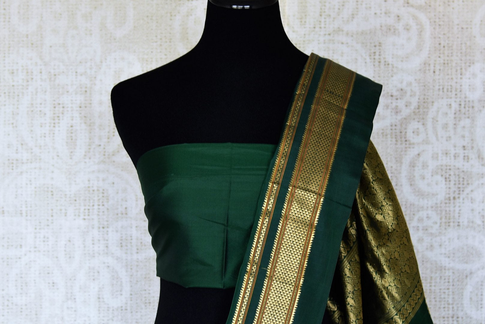 Buy gorgeous cream floral print Gadhwal silk sari online in USA with green zari border. Be the center of attraction at weddings and special occasions in exquisite designer sarees, handwoven silk saris, organza sarees, pure silk saris from Pure Elegance Indian fashion store in USA.-blouse pallu