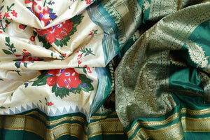 Buy gorgeous cream floral print Gadhwal silk sari online in USA with green zari border. Be the center of attraction at weddings and special occasions in exquisite designer sarees, handwoven silk saris, organza sarees, pure silk saris from Pure Elegance Indian fashion store in USA.-details