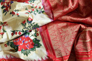 Shop stunning cream floral print Gadhwal silk sari online in USA with red zari border. Be the center of attraction at weddings and special occasions in exquisite designer sarees, handwoven silk saris, organza sarees, pure silk saris from Pure Elegance Indian fashion store in USA.-details