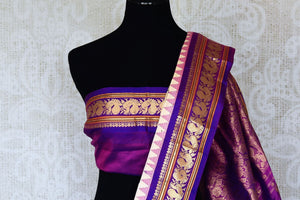 Shop beautiful cream floral print Gadhwal silk saree online in USA with purple zari border. Be the center of attraction at weddings and special occasions in exquisite designer sarees, handwoven silk saris, organza sarees, pure silk saris from Pure Elegance Indian fashion store in USA.-blouse pallu