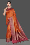 Shop gorgeous rust orange tussar silk saree online in USA with pink antique golden zari border. Be the center of attraction at weddings and special occasions in exquisite designer sarees, handwoven silk saris, embroidered sarees, pure silk sarees from Pure Elegance Indian fashion store in USA.-full view