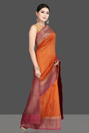 Shop gorgeous rust orange tussar silk saree online in USA with pink antique golden zari border. Be the center of attraction at weddings and special occasions in exquisite designer sarees, handwoven silk saris, embroidered sarees, pure silk sarees from Pure Elegance Indian fashion store in USA.-right