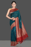 Shop stunning teal green tussar silk saree online in USA with red antique golden zari border. Be the center of attraction at weddings and special occasions in exquisite designer sarees, handwoven silk saris, embroidered sarees, pure silk sarees from Pure Elegance Indian fashion store in USA.-full view