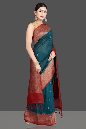 Shop stunning teal green tussar silk saree online in USA with red antique golden zari border. Be the center of attraction at weddings and special occasions in exquisite designer sarees, handwoven silk saris, embroidered sarees, pure silk sarees from Pure Elegance Indian fashion store in USA.-side