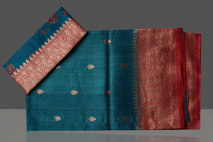 Shop stunning teal green tussar silk saree online in USA with red antique golden zari border. Be the center of attraction at weddings and special occasions in exquisite designer sarees, handwoven silk saris, embroidered sarees, pure silk sarees from Pure Elegance Indian fashion store in USA.-blouse