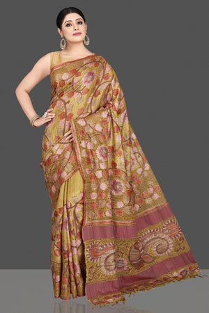 Buy beautiful green tussar silk saree online in USA with Kalamkari cut work border. Be the center of attraction at weddings and special occasions in exquisite designer sarees, handwoven silk sarees, embroidered saris, pure silk sarees from Pure Elegance Indian fashion store in USA.-front