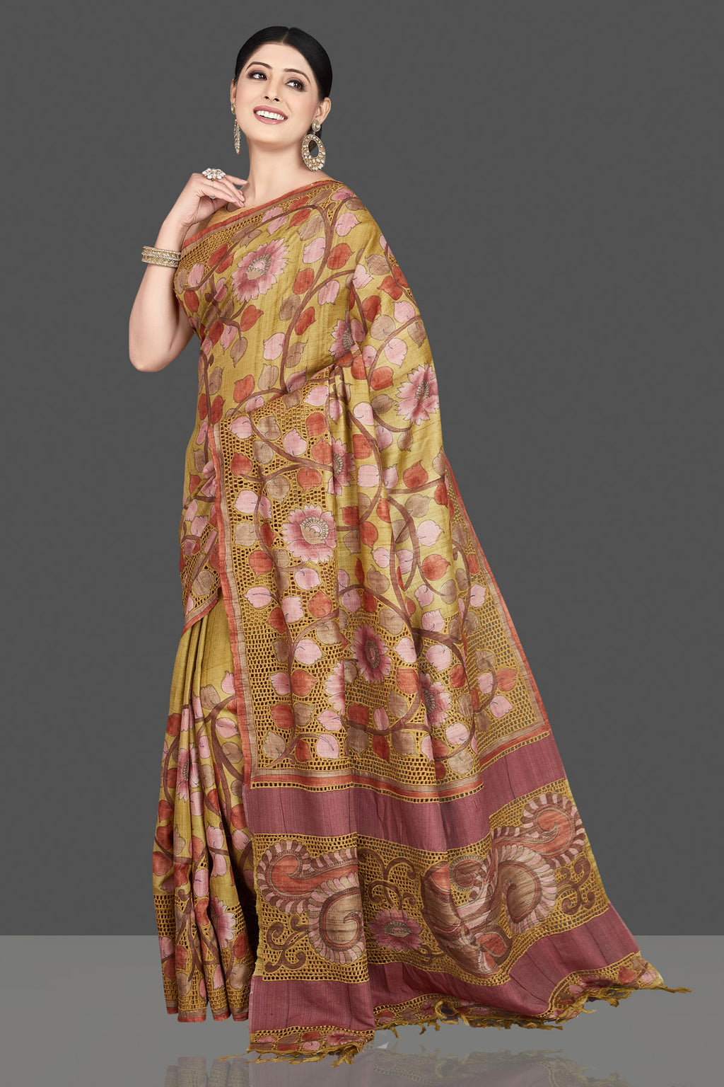 Buy beautiful green tussar silk saree online in USA with Kalamkari cut work border. Be the center of attraction at weddings and special occasions in exquisite designer sarees, handwoven silk sarees, embroidered saris, pure silk sarees from Pure Elegance Indian fashion store in USA.-full view