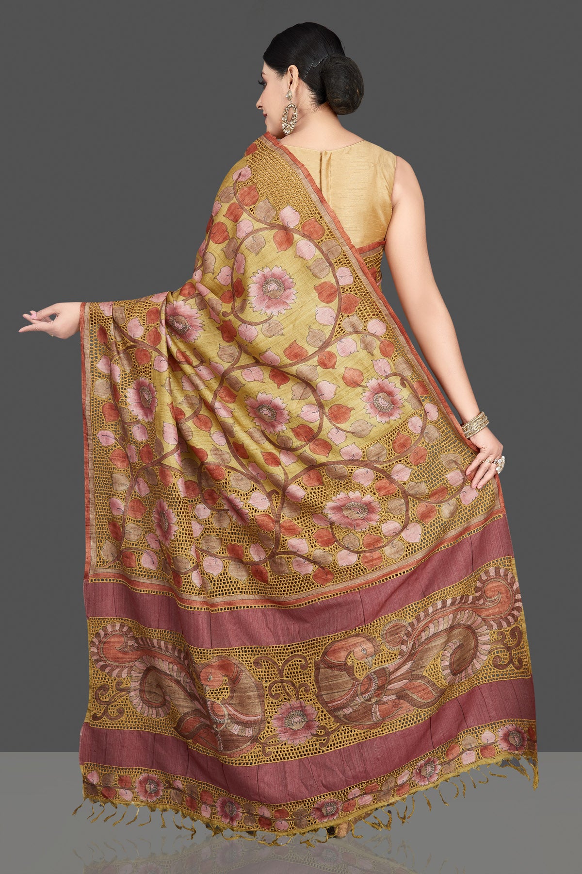 Buy beautiful green tussar silk saree online in USA with Kalamkari cut work border. Be the center of attraction at weddings and special occasions in exquisite designer sarees, handwoven silk sarees, embroidered saris, pure silk sarees from Pure Elegance Indian fashion store in USA.-back