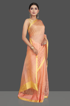 Shop gorgeous peach matka silk saree online in USA with golden border. Be the center of attraction at weddings and special occasions in exquisite designer sarees, handwoven silk saris, embroidered sarees, pure silk sarees from Pure Elegance Indian fashion store in USA.-front