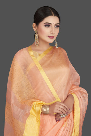 Shop gorgeous peach matka silk saree online in USA with golden border. Be the center of attraction at weddings and special occasions in exquisite designer sarees, handwoven silk saris, embroidered sarees, pure silk sarees from Pure Elegance Indian fashion store in USA.-closeup