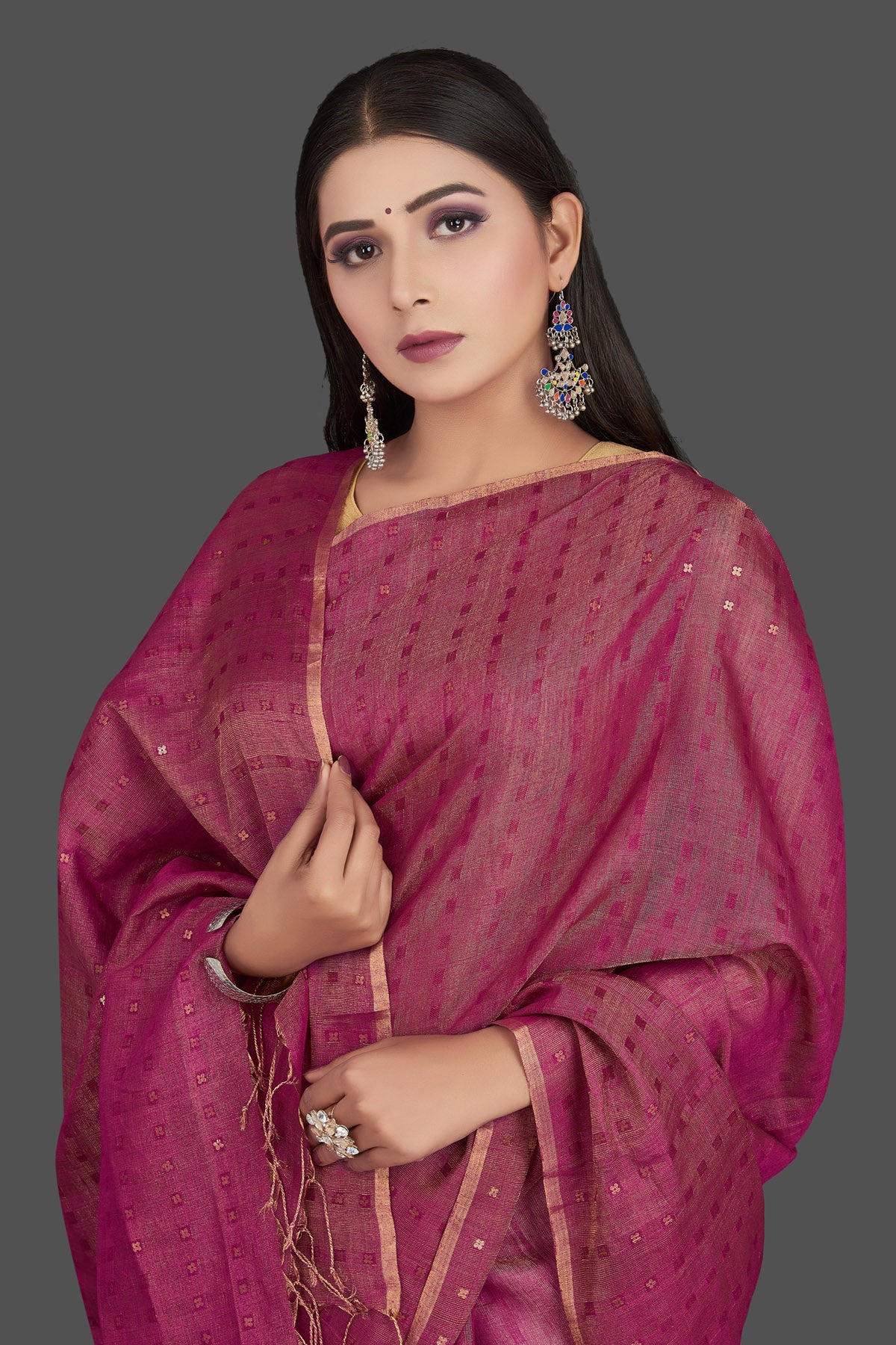 Shop stunning magenta matka silk saree online in USA with golden border. Be the center of attraction at weddings and special occasions in exquisite designer sarees, handwoven silk saris, embroidered sarees, pure silk sarees from Pure Elegance Indian fashion store in USA.-closeup