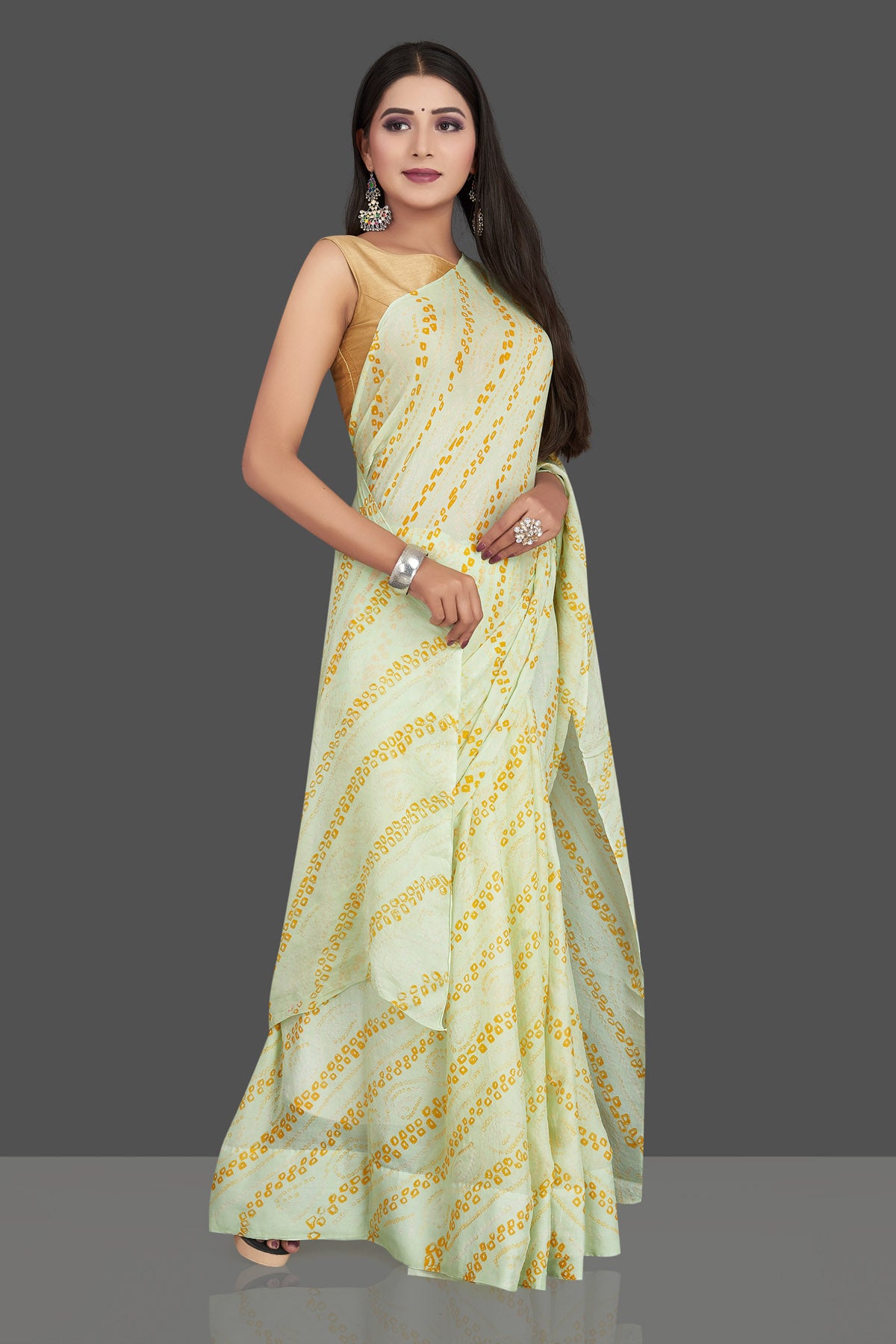Shop stunning light yellow bandhani print chiffon sari online in USA. Be the center of attraction at weddings and special occasions in exquisite designer sarees, handwoven silk saris, embroidered sarees, pure silk sarees from Pure Elegance Indian fashion store in USA.-right