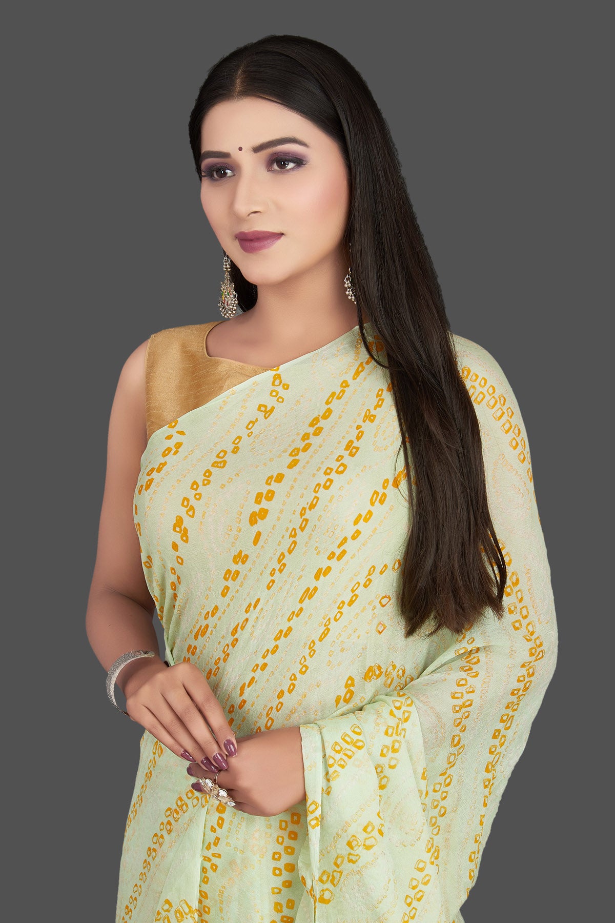 Shop stunning light yellow bandhani print chiffon sari online in USA. Be the center of attraction at weddings and special occasions in exquisite designer sarees, handwoven silk saris, embroidered sarees, pure silk sarees from Pure Elegance Indian fashion store in USA.-closeup