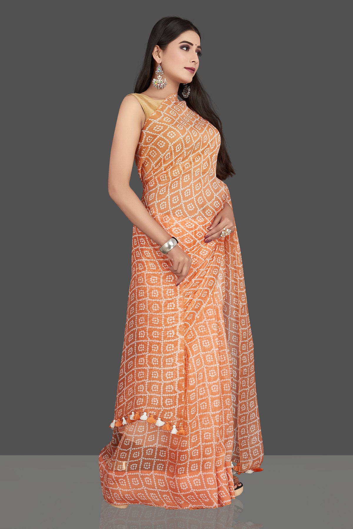 Shop stunning peach printed organza silk saree online in USA. Be the center of attraction at weddings and special occasions in exquisite designer sarees, handwoven silk sarees, embroidered saris, pure silk saris from Pure Elegance Indian fashion store in USA.-right