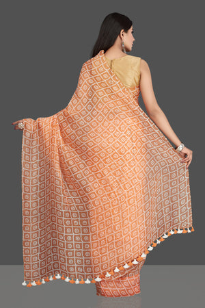 Shop stunning peach printed organza silk saree online in USA. Be the center of attraction at weddings and special occasions in exquisite designer sarees, handwoven silk sarees, embroidered saris, pure silk saris from Pure Elegance Indian fashion store in USA.-back