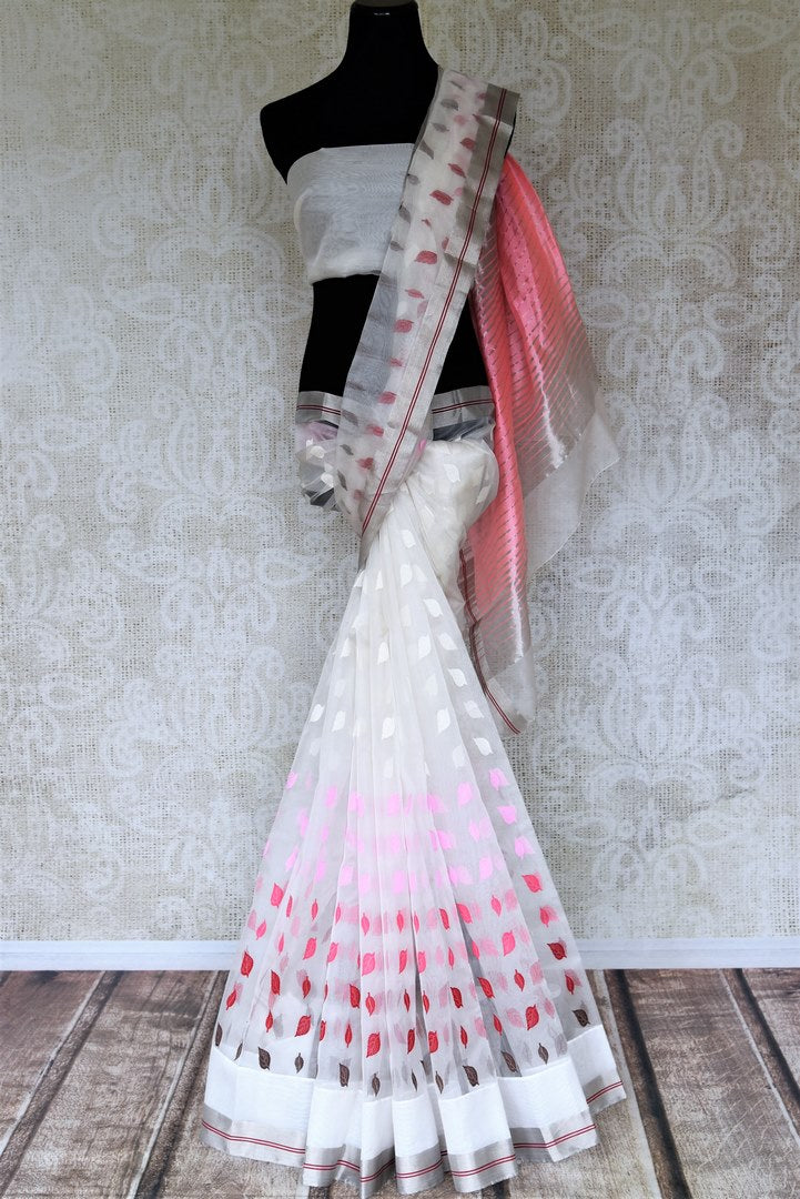 Shop gorgeous white chanderi silk saree online in USA with leaf buta on the border. Be the center of attraction at parties and weddings in exclusive Kanchipuram silk sarees, pure silk sarees, handloom silk sarees, Banarasi silk sarees from Pure Elegance Indian fashion store in USA.-full view