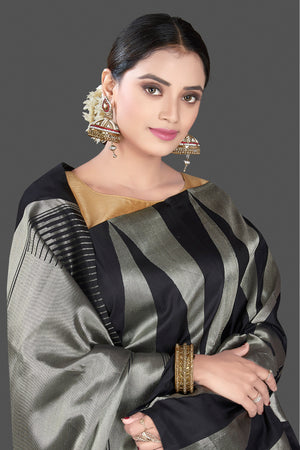 Shop stunning black and silver Kanchipuram saree online in USA. Go for a rich traditional look at weddings and festive occasions in exclusive Kanchipuram silk sarees. south silk sarees, handloom silk sarees, Banarasi saris from Pure Elegance Indian fashion store in USA.-closeup