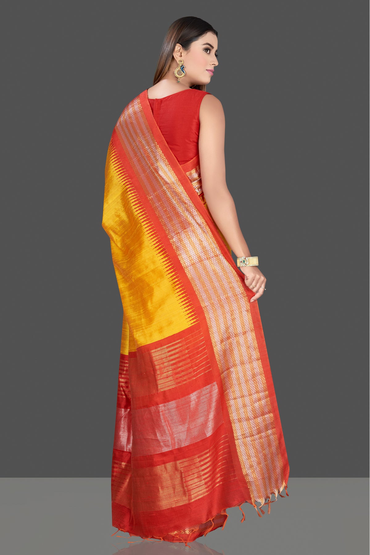 Shop gorgeous yellow silk saree online in USA with red tissue zari border. Look traditional on special occasions and weddings in gorgeous silk sarees, Kanjivaram sarees, south silk sarees, handloom silk sarees from Pure Elegance Indian saree store in USA.-back