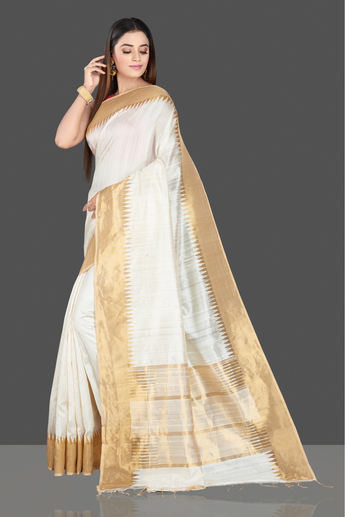 Buy beautiful cream silk saree online in USA with golden temple zari border. Look traditional on special occasions and weddings in gorgeous silk sarees, Kanjivaram sarees, south silk sarees, handloom silk sarees from Pure Elegance Indian saree store in USA.-full view
