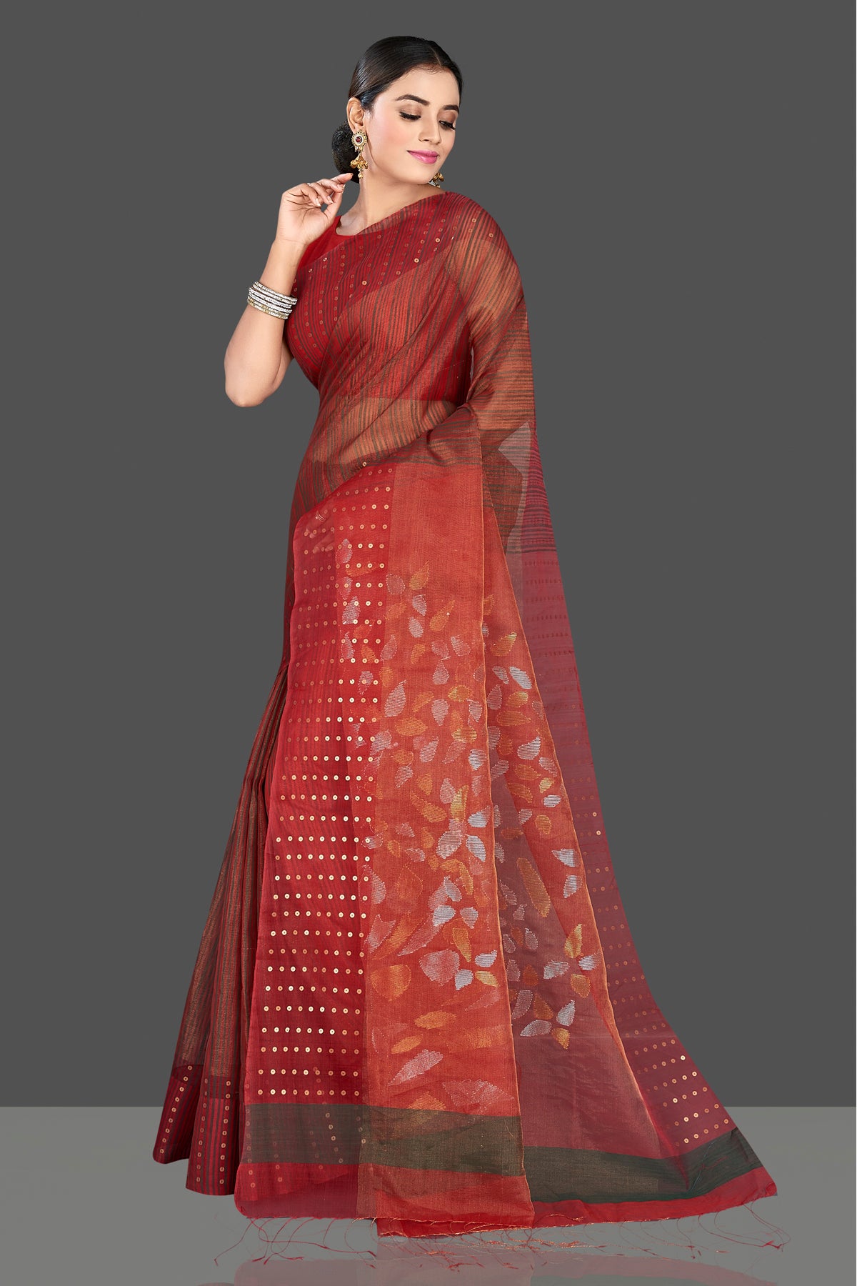 Shop stunning maroon muslin Jamdani saree online in USA with sequin border. Radiate traditional elegance on festive occasions in beautiful handloom silk sarees, paithani sarees, Lucknowi sarees, embroidered sarees from Pure Elegance Indian saree store in USA.-pallu