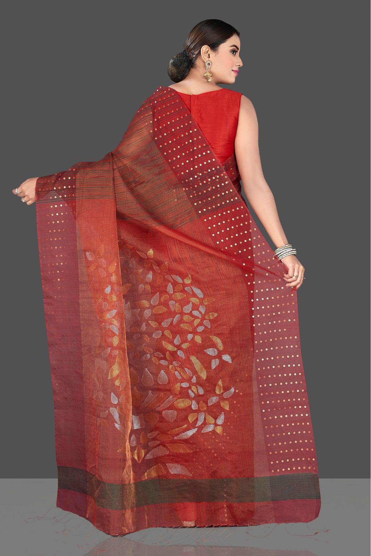 Shop stunning maroon muslin Jamdani saree online in USA with sequin border. Radiate traditional elegance on festive occasions in beautiful handloom silk sarees, paithani sarees, Lucknowi sarees, embroidered sarees from Pure Elegance Indian saree store in USA.-back
