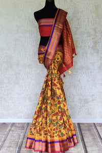 Buy beautiful mustard floral print Gadhwal silk saree online in USA with multicolor border. Be the center of attraction at parties and weddings in exclusive Kanchipuram silk sarees, pure silk sarees, handloom silk sarees, Banarasi silk sarees from Pure Elegance Indian fashion store in USA.-full view