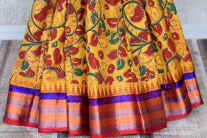 Buy beautiful mustard floral print Gadhwal silk saree online in USA with multicolor border. Be the center of attraction at parties and weddings in exclusive Kanchipuram silk sarees, pure silk sarees, handloom silk sarees, Banarasi silk sarees from Pure Elegance Indian fashion store in USA.-pleats