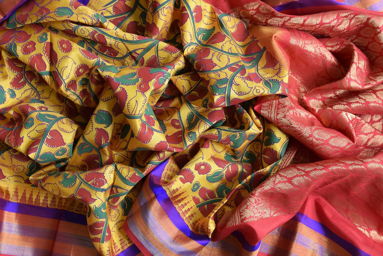 Buy beautiful mustard floral print Gadhwal silk saree online in USA with multicolor border. Be the center of attraction at parties and weddings in exclusive Kanchipuram silk sarees, pure silk sarees, handloom silk sarees, Banarasi silk sarees from Pure Elegance Indian fashion store in USA.-details