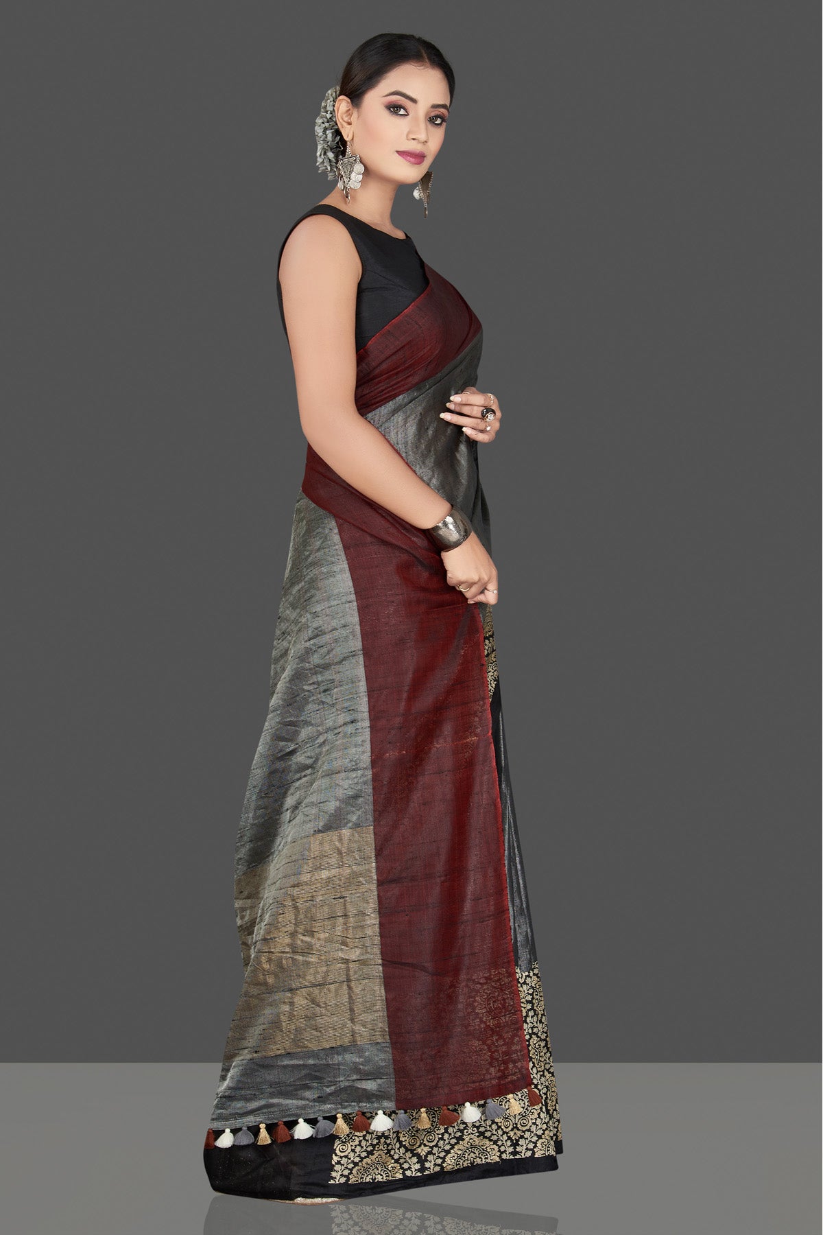 Buy beautiful grey tussar raw silk sari online in USA with black zari border. Keep your Indian wardrobe update with exclusive designer sarees, pure silk sarees, handloom silk sarees, Banarasi sarees from Pure Elegance Indian fashion store in USA.-right