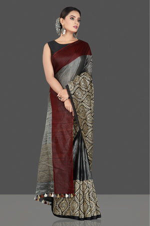 Buy beautiful grey tussar raw silk sari online in USA with black zari border. Keep your Indian wardrobe update with exclusive designer sarees, pure silk sarees, handloom silk sarees, Banarasi sarees from Pure Elegance Indian fashion store in USA.-front