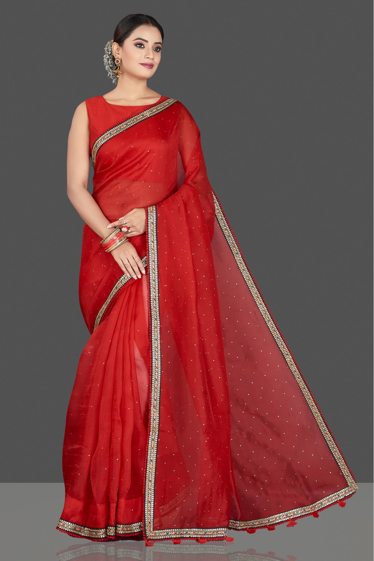 Buy stunning red organza saree online in USA with embroidered border. Keep your Indian wardrobe update with exclusive designer sarees, pure silk sarees, handloom silk sarees, Banarasi sarees from Pure Elegance Indian fashion store in USA.-full view