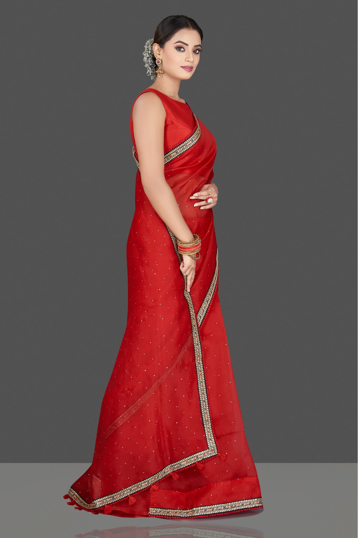 Buy stunning red organza saree online in USA with embroidered border. Keep your Indian wardrobe update with exclusive designer sarees, pure silk sarees, handloom silk sarees, Banarasi sarees from Pure Elegance Indian fashion store in USA.-right