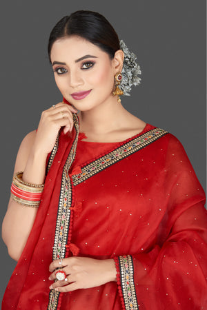 Buy stunning red organza saree online in USA with embroidered border. Keep your Indian wardrobe update with exclusive designer sarees, pure silk sarees, handloom silk sarees, Banarasi sarees from Pure Elegance Indian fashion store in USA.-closeup