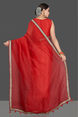 Buy stunning red organza saree online in USA with embroidered border. Keep your Indian wardrobe update with exclusive designer sarees, pure silk sarees, handloom silk sarees, Banarasi sarees from Pure Elegance Indian fashion store in USA.-back
