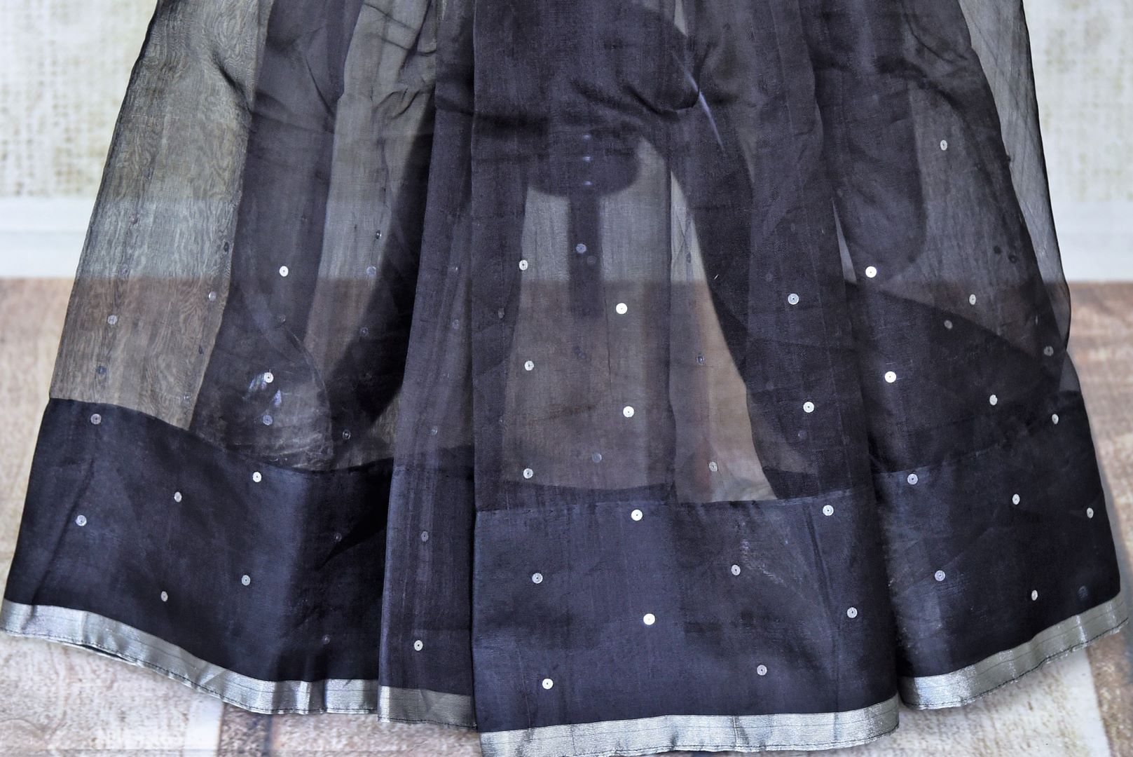 Shop beautiful black muslin matka silk saree online in USA with silver aanchal. Be the center of attraction on special occasions in beautiful handloom sarees, matka silk sarees, pure silk saris, Kanchipuram silk sarees, south silk sarees from Pure Elegance Indian saree store in USA.-pleats