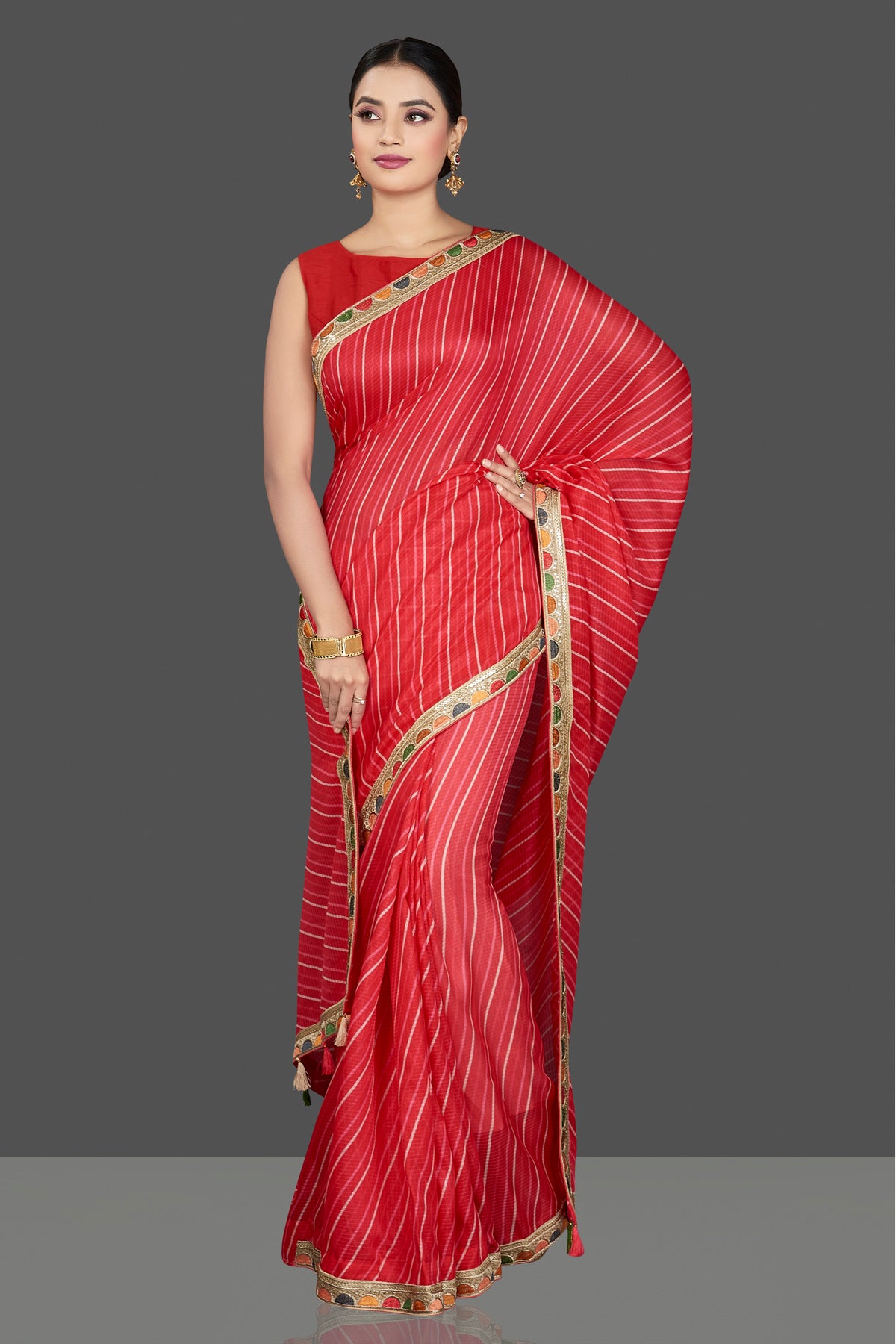 Shop gorgeous red Kota saree online in USA with lace border. Be the center of attraction on special occasion in beautiful designer sarees, handloom sarees, Kota silk sarees, Banarasi saris, Kanchipuram silk sarees from Pure Elegance Indian saree store in USA.-full view